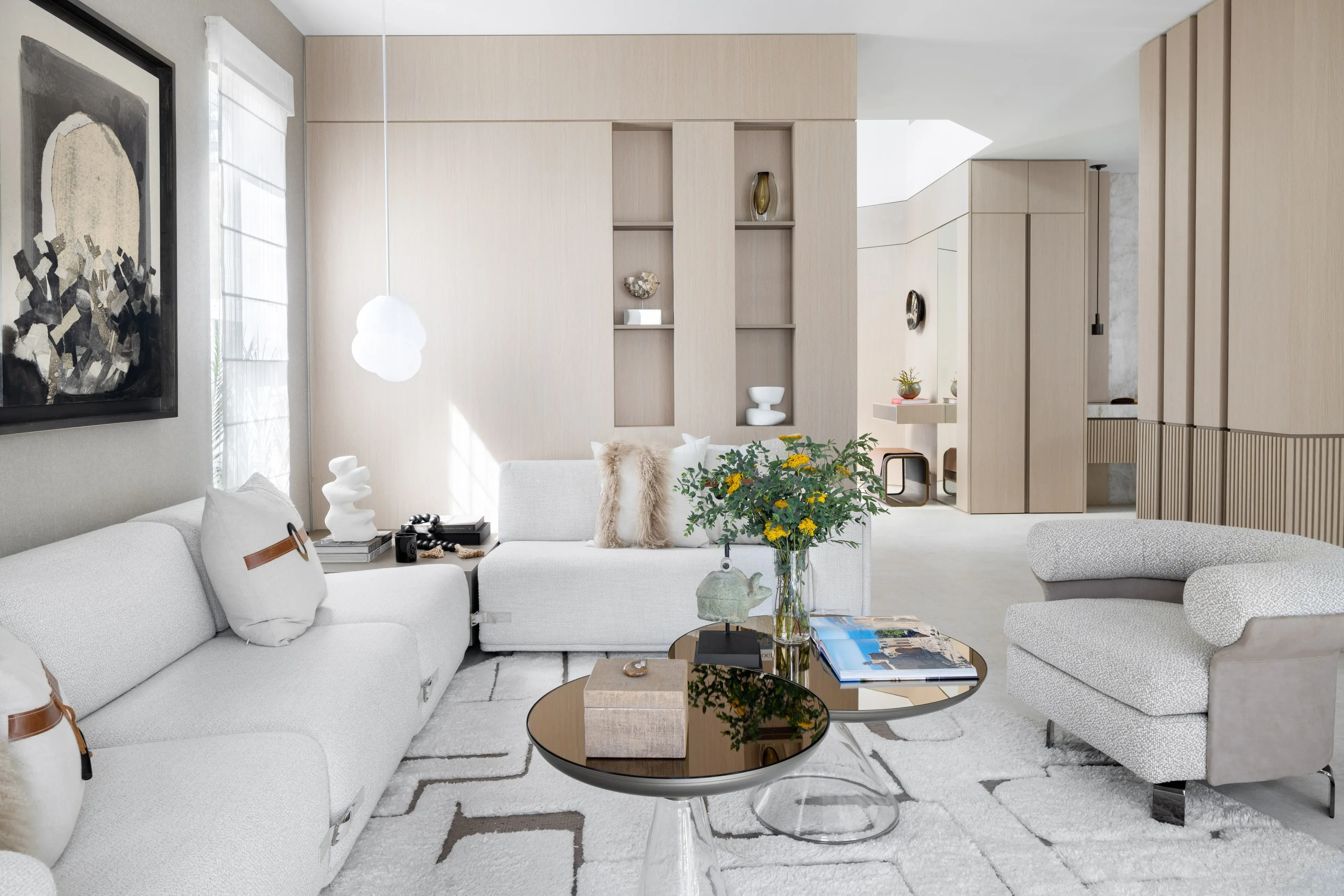 A bespoke hand-knotted rug anchoring a refined contemporary living room